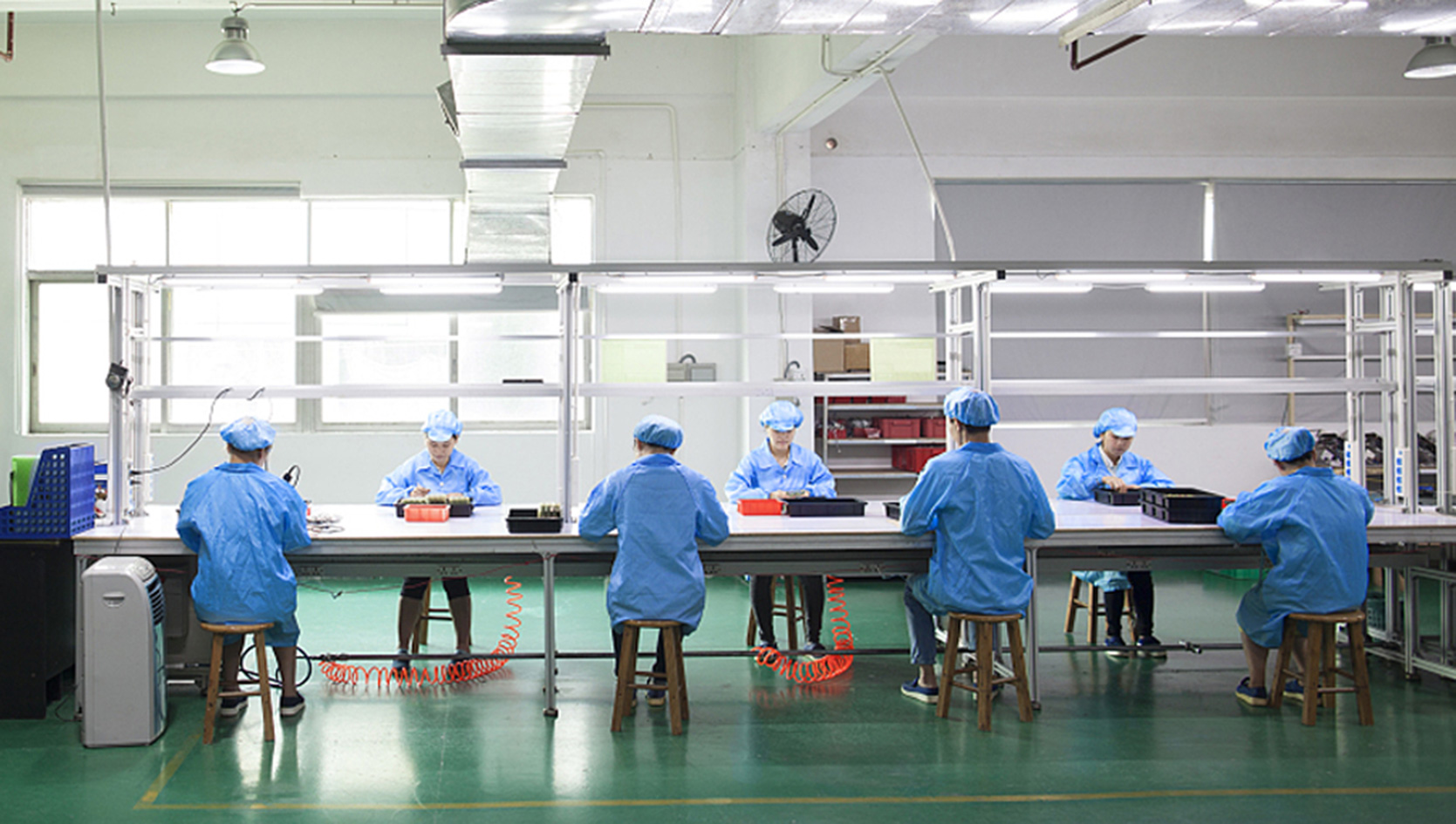 YARMEE manufacturing facility β workers at production line